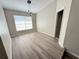 Cozy dining area features modern lighting fixture and a window, creating an inviting atmosphere at 838 Haulover Dr, Altamonte Springs, FL 32714