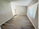 Bright living room with hardwood floors and large window offering ample natural light at 838 Haulover Dr, Altamonte Springs, FL 32714