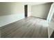 Bright living room with fresh paint, new floors, and elegant wainscoting at 838 Haulover Dr, Altamonte Springs, FL 32714