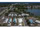 Aerial view highlighting a home's location within a neighborhood, close to the lake and local amenities at 106 Turtle Run, Umatilla, FL 32784