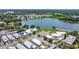 Aerial view of a residential neighborhood, showcasing lakefront property with common green space at 106 Turtle Run, Umatilla, FL 32784