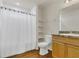 Bathroom featuring shower, toilet, and a vanity with granite countertop at 106 Turtle Run, Umatilla, FL 32784