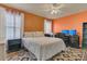 Comfortable bedroom with a queen size bed and a dedicated desk for home office tasks at 106 Turtle Run, Umatilla, FL 32784