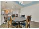 Bright dining room with a large table perfect for Gathering meals, with access to the open concept kitchen and breakfast bar at 106 Turtle Run, Umatilla, FL 32784
