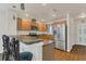 Spacious kitchen featuring stainless steel appliances and a convenient breakfast bar for casual dining or entertaining guests at 106 Turtle Run, Umatilla, FL 32784