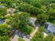 Expansive property with mature trees, a long driveway, and a well-maintained home offers privacy and curb appeal at 1202 Marshall Ct, Eustis, FL 32726
