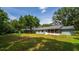 Large backyard featuring a screened-in porch and a play structure at 1202 Marshall Ct, Eustis, FL 32726