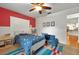 Charming bedroom with colorful rug, playful decor, and a bright accent wall at 1202 Marshall Ct, Eustis, FL 32726