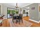 Elegant dining room with hardwood floors and sliding glass doors to the patio at 1202 Marshall Ct, Eustis, FL 32726