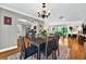 Dining area seamlessly connects to the kitchen and living areas, enhanced with hardwood floors and natural light at 1202 Marshall Ct, Eustis, FL 32726