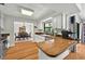Bright kitchen with a wood-top bar area overlooking the dining room at 1202 Marshall Ct, Eustis, FL 32726