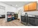 Functional laundry room featuring a washer, dryer, and ample storage space at 1202 Marshall Ct, Eustis, FL 32726
