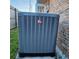 Rheem AC unit providing efficient cooling, sits adjacent to a classic brick wall at 1233 Gladstone Dr, Deltona, FL 32725