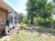 View of the pool and house from a slightly elevated position. Shed also visible at 1233 Gladstone Dr, Deltona, FL 32725
