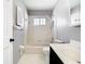 Bright bathroom featuring a shower-tub combination with a window and updated fixtures at 1233 Gladstone Dr, Deltona, FL 32725