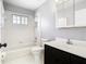 Bathroom featuring a shower-tub combination, window, toilet, and modern sink with cabinet at 1233 Gladstone Dr, Deltona, FL 32725