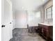 Updated bathroom featuring a sleek vanity, framed glass shower, and tile floors at 1233 Gladstone Dr, Deltona, FL 32725