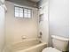 Bright bathroom featuring a shower-tub combination with white tiling and updated fixtures at 1233 Gladstone Dr, Deltona, FL 32725