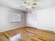 Light and airy bedroom with gleaming wood floors, and double door closet at 1233 Gladstone Dr, Deltona, FL 32725