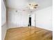 Bedroom with wood floors, a large window and closet, leading to the doorway at 1233 Gladstone Dr, Deltona, FL 32725