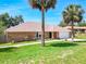 Attractive brick home featuring a two-car garage and well-maintained landscaping at 1233 Gladstone Dr, Deltona, FL 32725