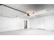 Clean, well-lit garage featuring a smooth floor and access door at 1233 Gladstone Dr, Deltona, FL 32725