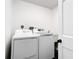 Bright laundry room featuring new white appliances and a convenient utility sink at 1233 Gladstone Dr, Deltona, FL 32725
