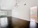 Bright living area boasts black tile flooring, recessed lighting, and a doorway to the next room at 1233 Gladstone Dr, Deltona, FL 32725