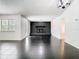 Spacious living room with a black brick fireplace and bright windows at 1233 Gladstone Dr, Deltona, FL 32725