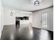 Open living space offering partial view of kitchen and back yard access at 1233 Gladstone Dr, Deltona, FL 32725