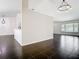 Open-concept living space with black tile flooring, neutral paint, and natural light from window to the front at 1233 Gladstone Dr, Deltona, FL 32725