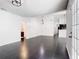 Bright living room features sleek tile floors, modern lighting, and opens to the kitchen at 1233 Gladstone Dr, Deltona, FL 32725