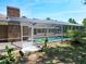 A refreshing screened-in pool with brick accents, perfect for outdoor relaxation and entertainment at 1233 Gladstone Dr, Deltona, FL 32725