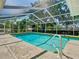 Backyard pool enclosed by a screen, perfect for summer fun at 1233 Gladstone Dr, Deltona, FL 32725