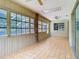 Enclosed sunroom offering a relaxing space with views of the backyard at 1233 Gladstone Dr, Deltona, FL 32725
