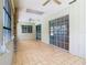 Bright sunroom with ceiling fans, offering versatile living space at 1233 Gladstone Dr, Deltona, FL 32725