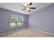 Cozy bedroom with neutral carpet and a bright window view at 12335 Cruxbury Dr, Windermere, FL 34786