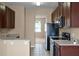 Efficient kitchen design with sleek appliances and granite countertops, complemented by ample cabinet space at 12335 Cruxbury Dr, Windermere, FL 34786