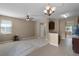 Cozy living space with a blend of carpet and tile flooring, complemented by stylish ceiling fan and pendant lighting at 12335 Cruxbury Dr, Windermere, FL 34786