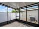 Screened-in patio featuring a view of the fenced yard and exterior air conditioning unit at 12335 Cruxbury Dr, Windermere, FL 34786