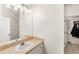 Bright bathroom featuring a vanity with a sink and modern lighting fixtures at 12837 Madison Pointe Cir # 206, Orlando, FL 32821
