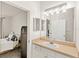 Bathroom featuring a vanity with a sink, modern lighting, and a bedroom view at 12837 Madison Pointe Cir # 206, Orlando, FL 32821