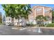 Attractive condo building with attached garages and accessible parking spaces at 12837 Madison Pointe Cir # 206, Orlando, FL 32821