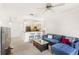 Open concept living room with a view of the kitchen at 12837 Madison Pointe Cir # 206, Orlando, FL 32821