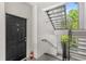 Well-lit exterior stairwell leading to the unit entrance at 12837 Madison Pointe Cir # 206, Orlando, FL 32821