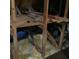 This attic features wooden beams, insulation, and storage space at 13111 Sunshine Cir, Clermont, FL 34711