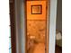 Compact bathroom with tiled walls, a vanity, and essential fixtures at 13111 Sunshine Cir, Clermont, FL 34711