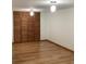 Spacious bedroom featuring a large closet with wooden doors and hardwood floors at 13111 Sunshine Cir, Clermont, FL 34711