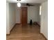Bedroom featuring a ceiling fan, light hardwood floors, and bright white walls at 13111 Sunshine Cir, Clermont, FL 34711