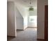 Bright carpeted bedroom with a green pendant light and white trim at 13111 Sunshine Cir, Clermont, FL 34711